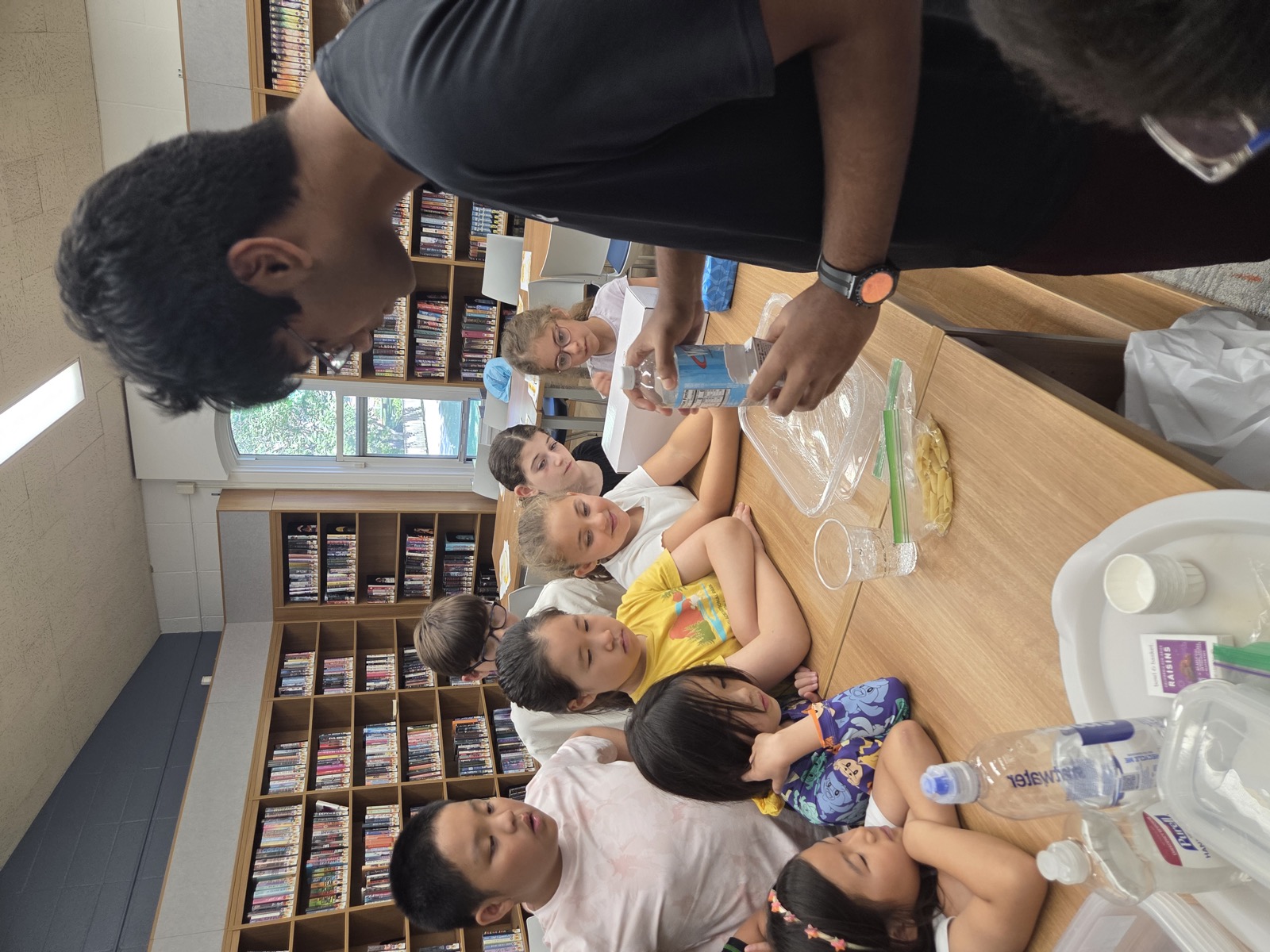 Students observing raisins dancing in carbonated water